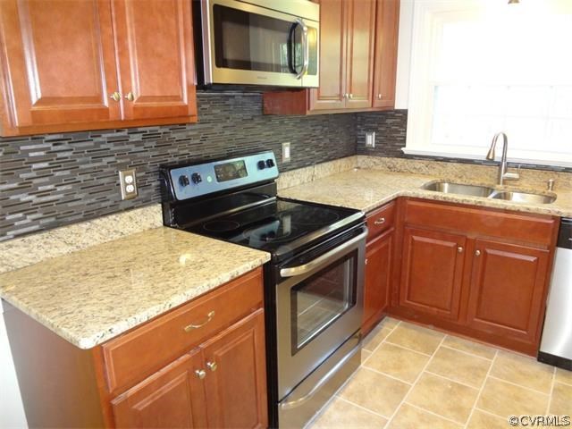 8074 Peaks Road Hanover, VA 23069 - Photo 5 of 28 a kitchen with a sink and cabinets
