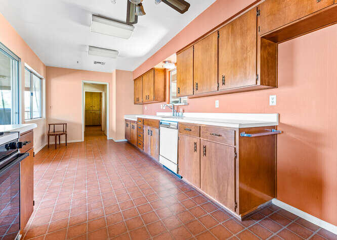 41000 Oak Ridge Drive Three Rivers, CA 93271 - Photo 11 of 39 a kitchen with stainless steel appliances granite countertop a sink and cabinets