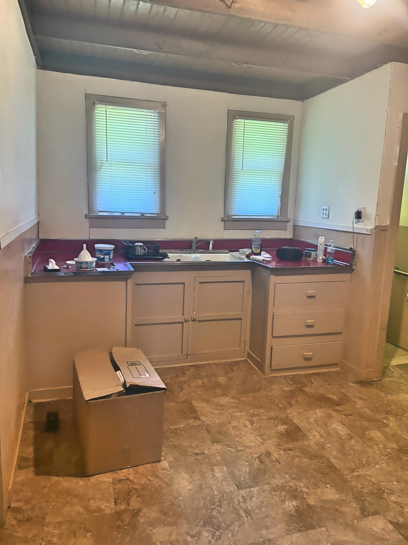 313 North 5th Street Watseka, IL 60970 - Photo 5 of 16 a bathroom with a granite countertop sink and a mirror