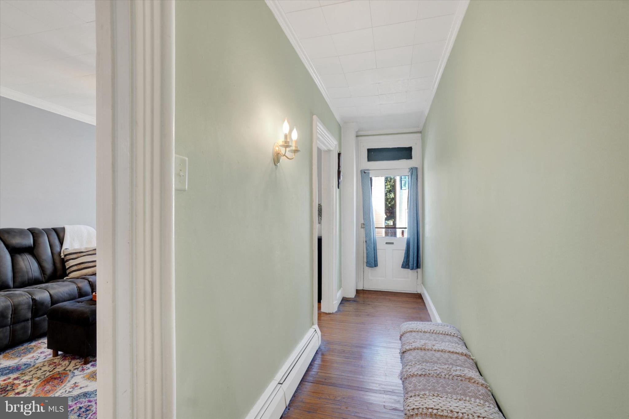 224 Perry Street Columbia, PA 17512 - Photo 4 of 34 Inviting hallway with natural light.