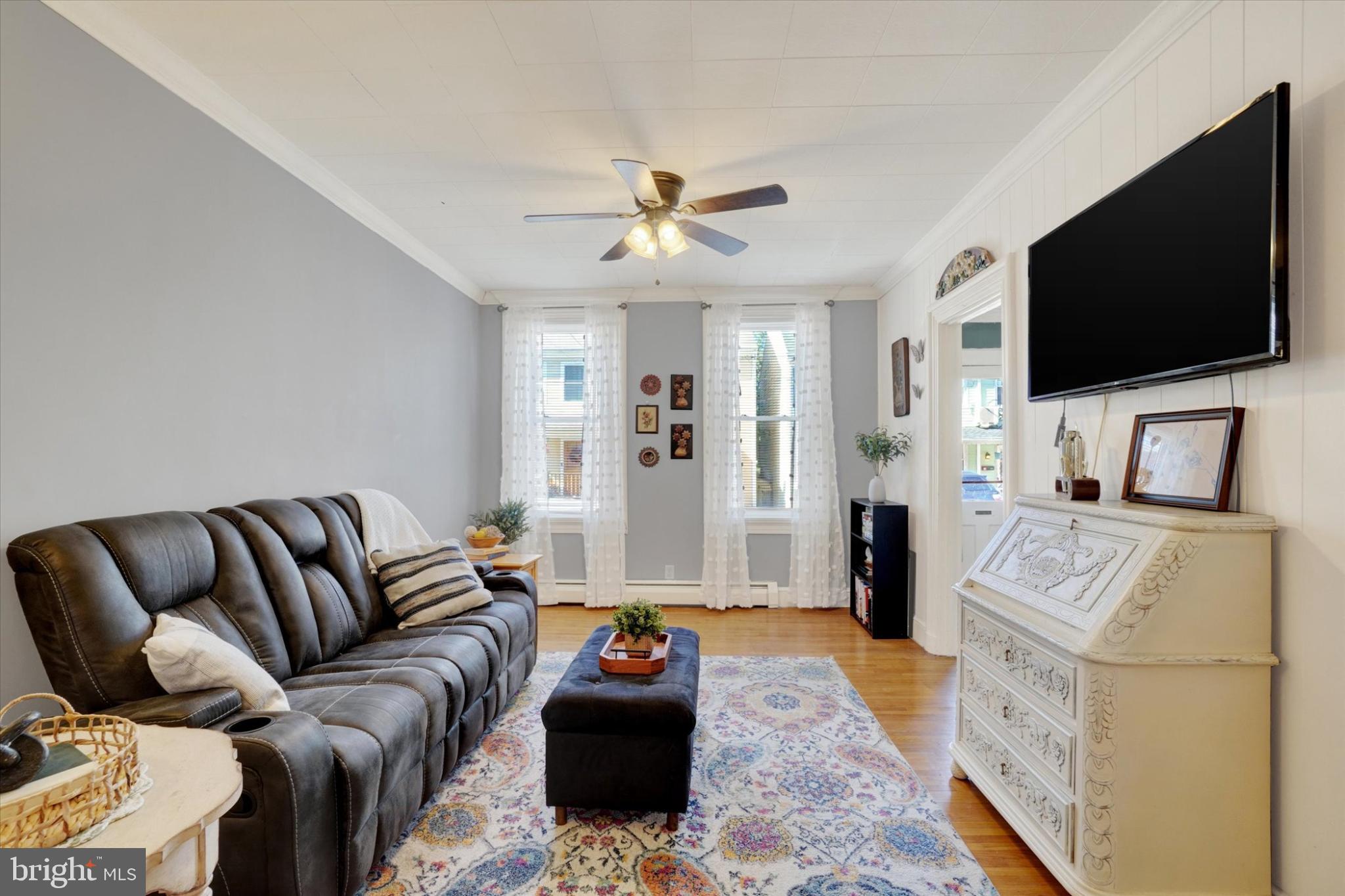 224 Perry Street Columbia, PA 17512 - Photo 6 of 34 Living space with natural light & hardwood floors.