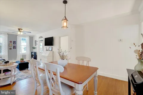 a view of a dining room with furniture and window