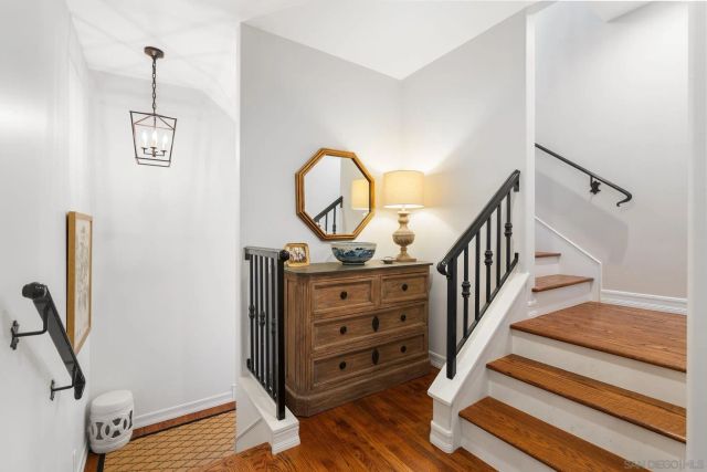 a view of a hallway with staircase