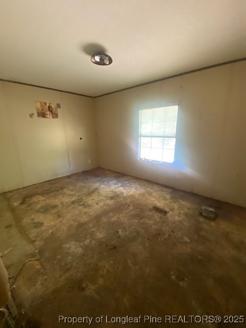 1329 McArthur Road Maxton, NC 28364 - Photo 11 of 12 en empty room with windows
