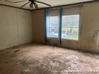 1329 McArthur Road Maxton, NC 28364 - Photo 2 of 12 an empty room with a window
