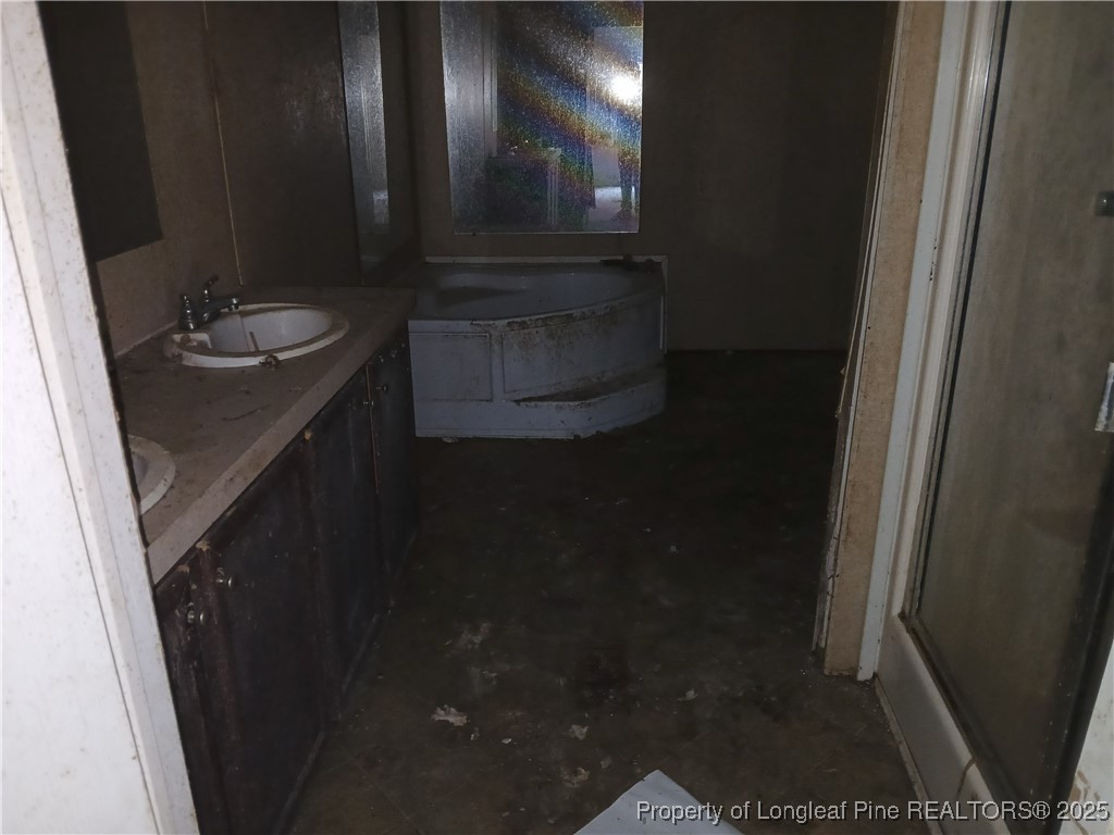 1329 McArthur Road Maxton, NC 28364 - Photo 7 of 12 a bathroom with a sink