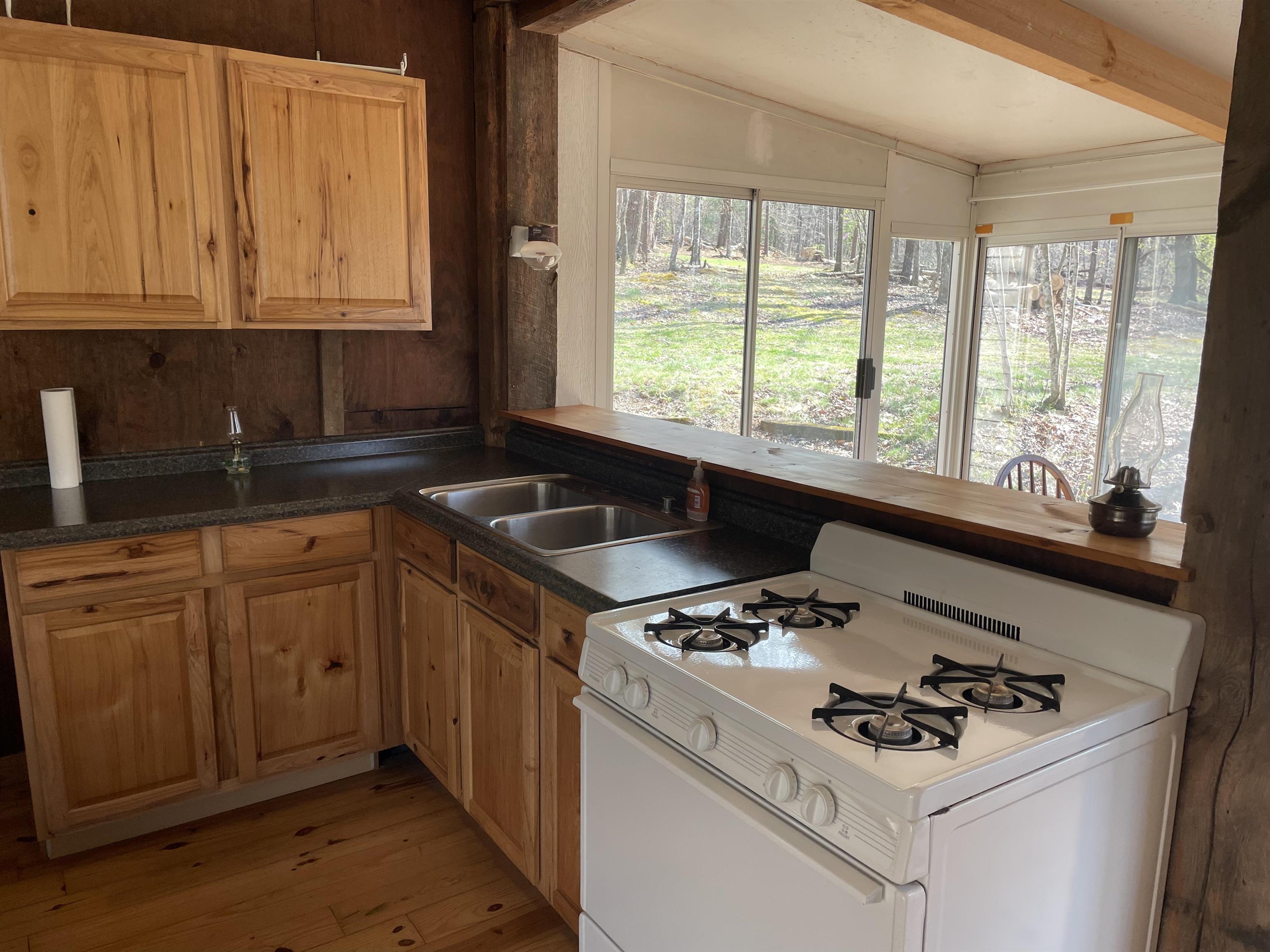 Lot 1 Hopkins Gap Road Fulks Run, VA 22830 - Photo 11 of 74 a kitchen with granite countertop a sink stove and cabinets