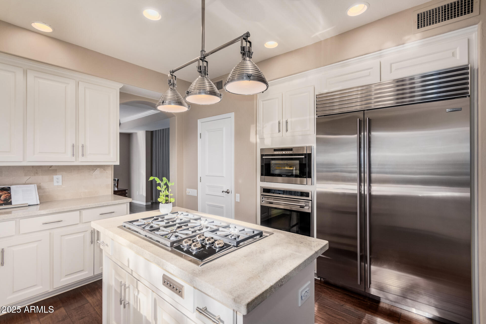 7878 East Gainey Ranch Road, Unit 41 Scottsdale, AZ 85258 - Photo 11 of 46 a kitchen with kitchen island a counter space a sink appliances and cabinets