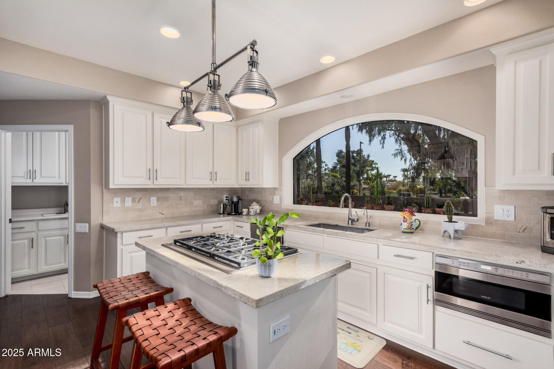 7878 East Gainey Ranch Road, Unit 41 Scottsdale, AZ 85258 - Photo 13 of 46 a kitchen with a stove a sink and a refrigerator