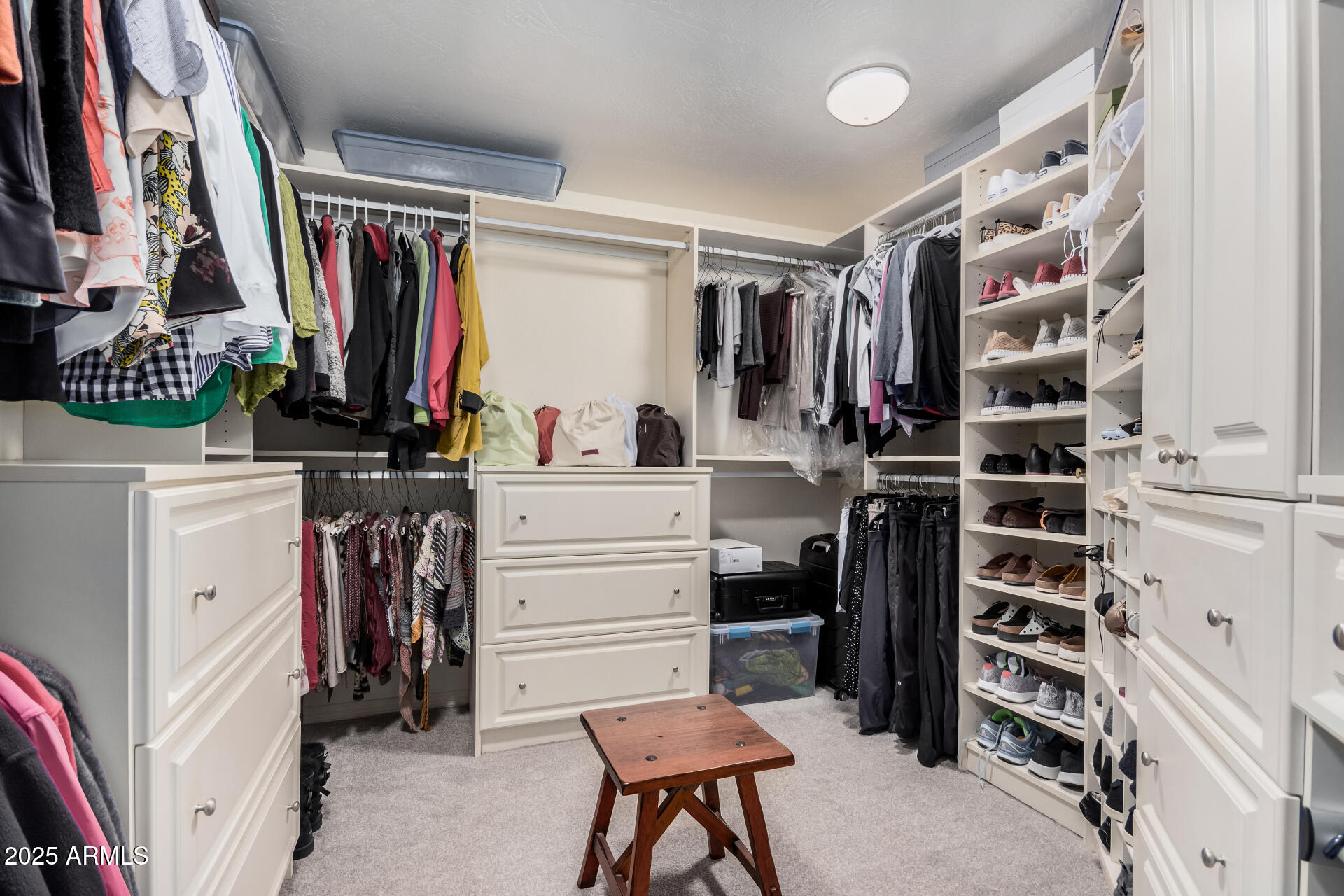 7878 East Gainey Ranch Road, Unit 41 Scottsdale, AZ 85258 - Photo 20 of 46 a view of walk in closet with clothes and shoes