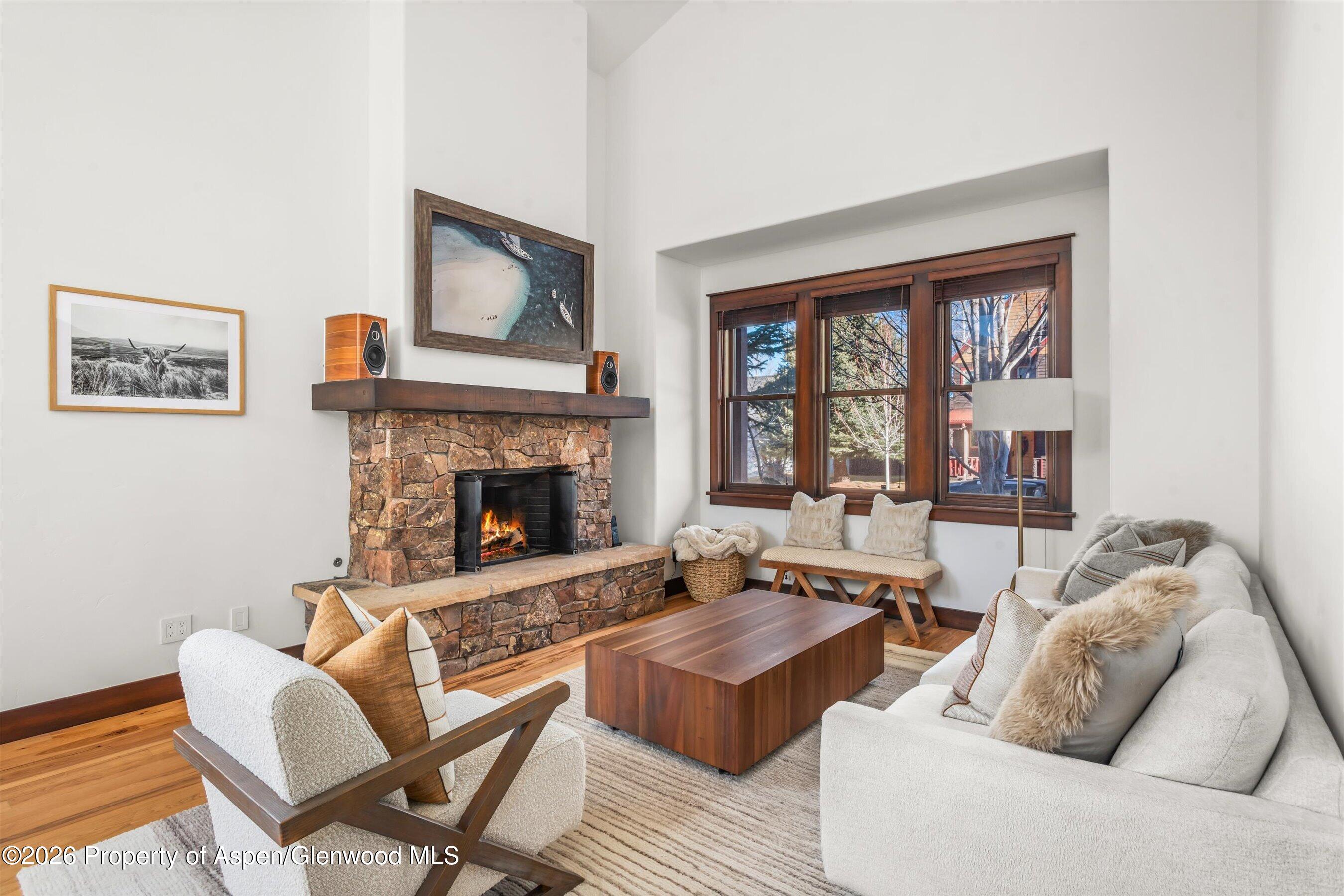 410 Meadow Court Basalt, CO 81621 - Photo 4 of 30 a living room with furniture and a fireplace