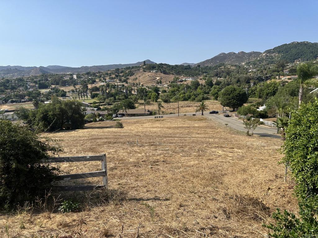 a view of a town with mountains in the background