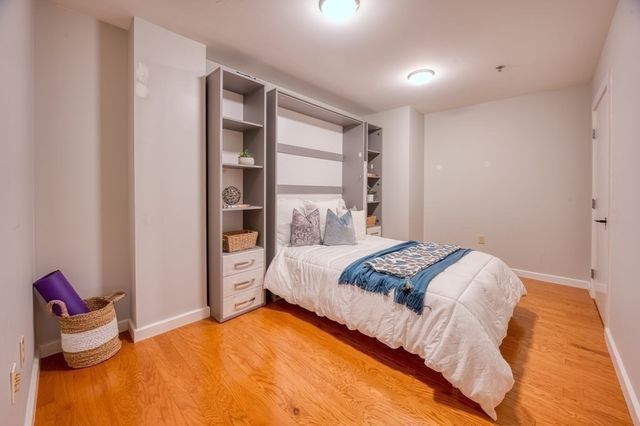 a bedroom with a bed and closet