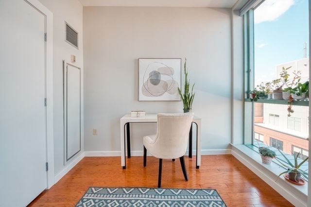 a workspace with furniture and window