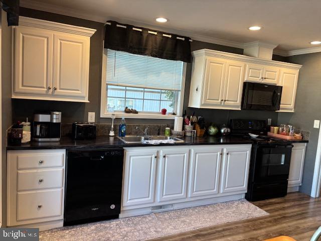 31706 Janice Road Lewes, DE 19958 - Photo 6 of 20 a kitchen with stainless steel appliances granite countertop a stove a sink and a microwave