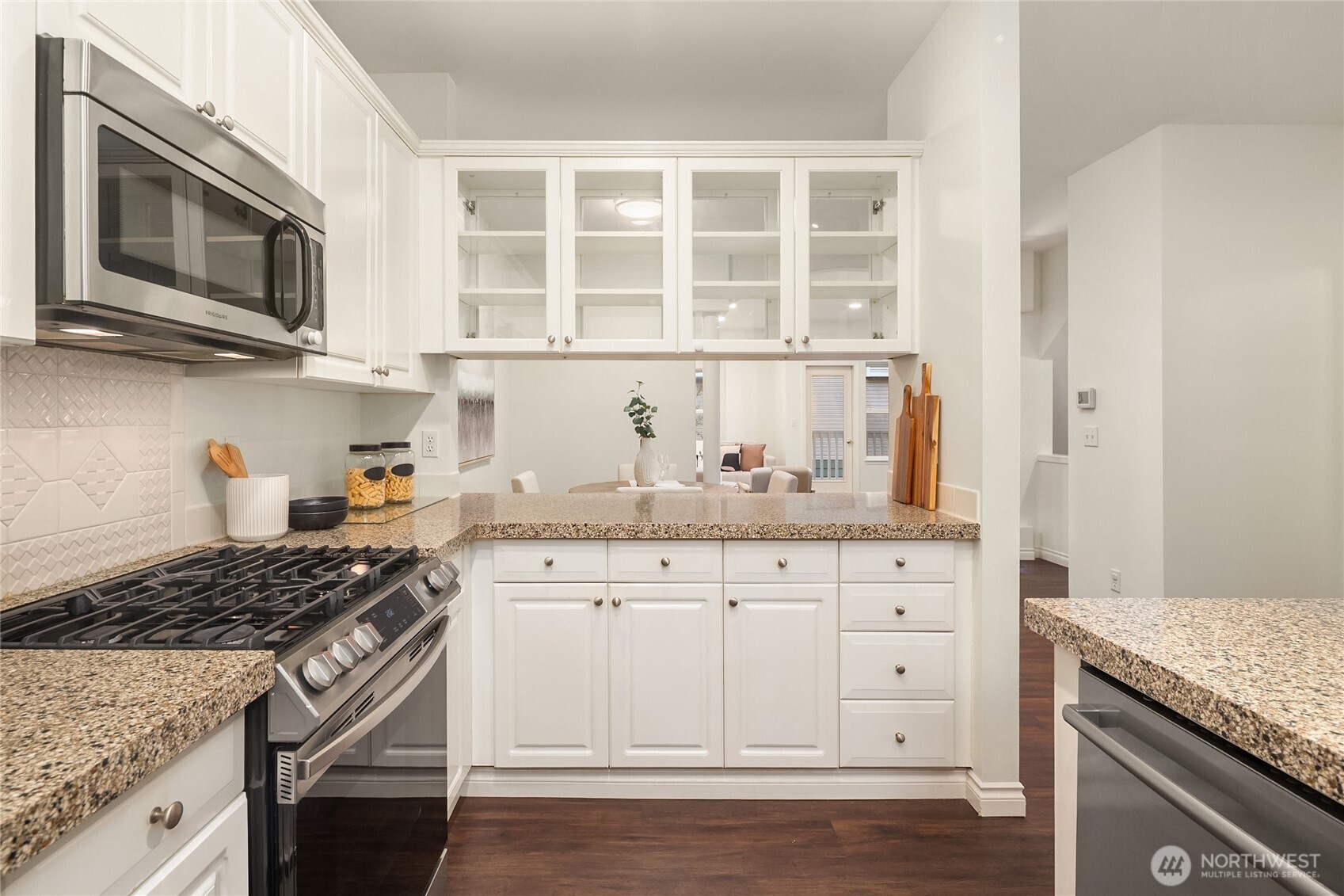 755 Northwest Juniper Street Issaquah, WA 98027 - Photo 16 of 39 a kitchen with granite countertop a stove and a microwave