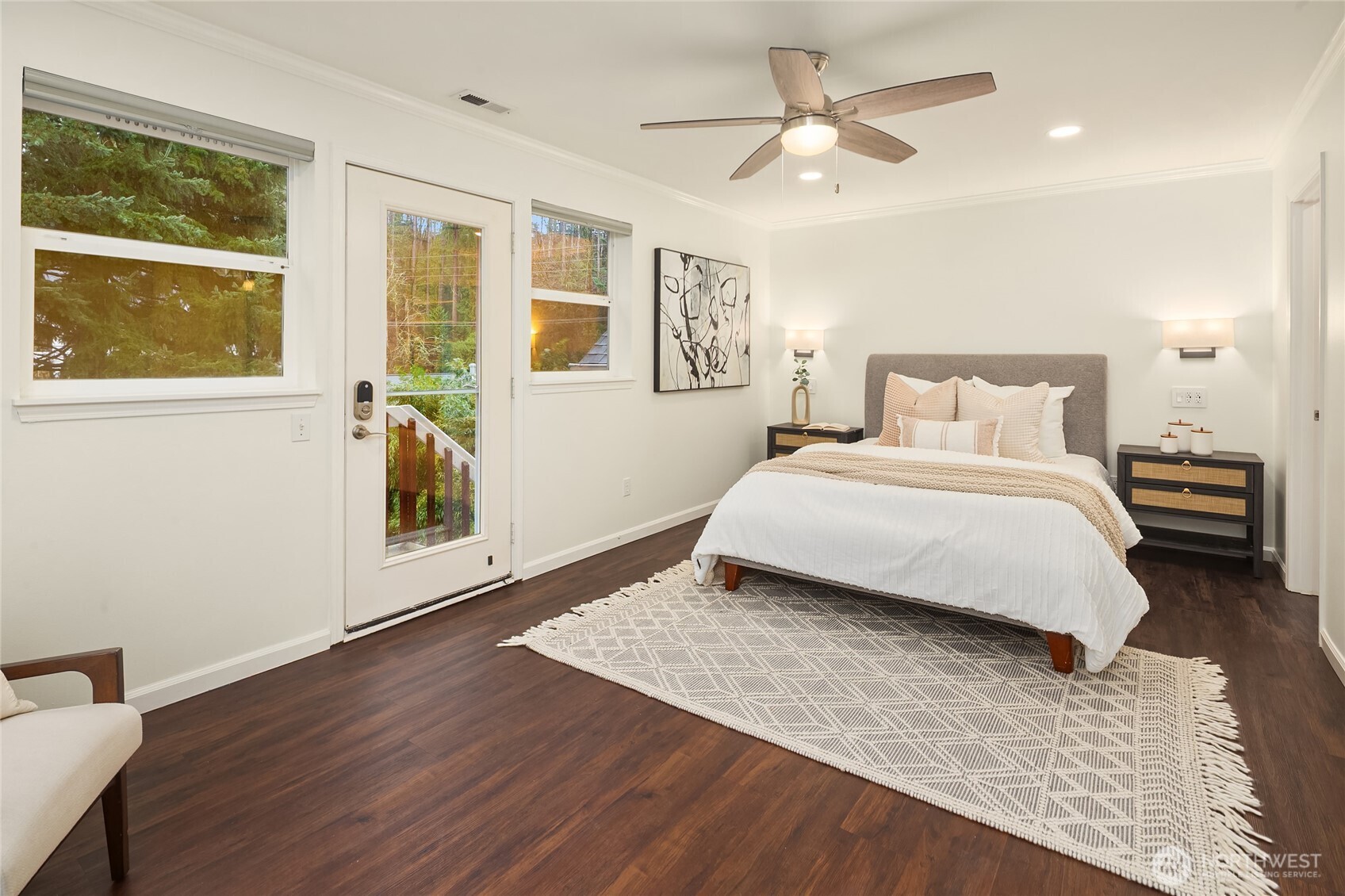 755 Northwest Juniper Street Issaquah, WA 98027 - Photo 20 of 39 a bedroom with a bed and wooden floor