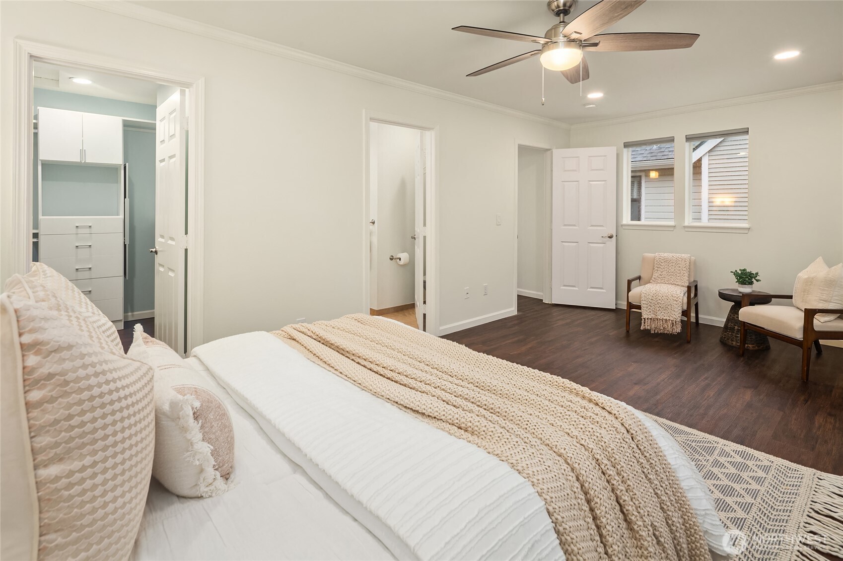 755 Northwest Juniper Street Issaquah, WA 98027 - Photo 21 of 39 a bedroom with a bed and a chandelier