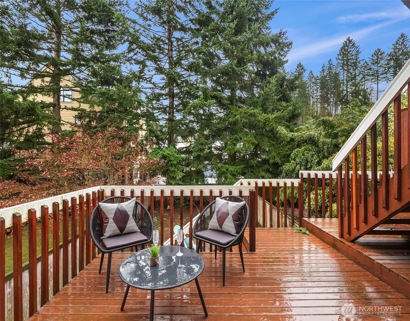 755 Northwest Juniper Street Issaquah, WA 98027 - Photo 38 of 39 a balcony with wooden floor and outdoor seating