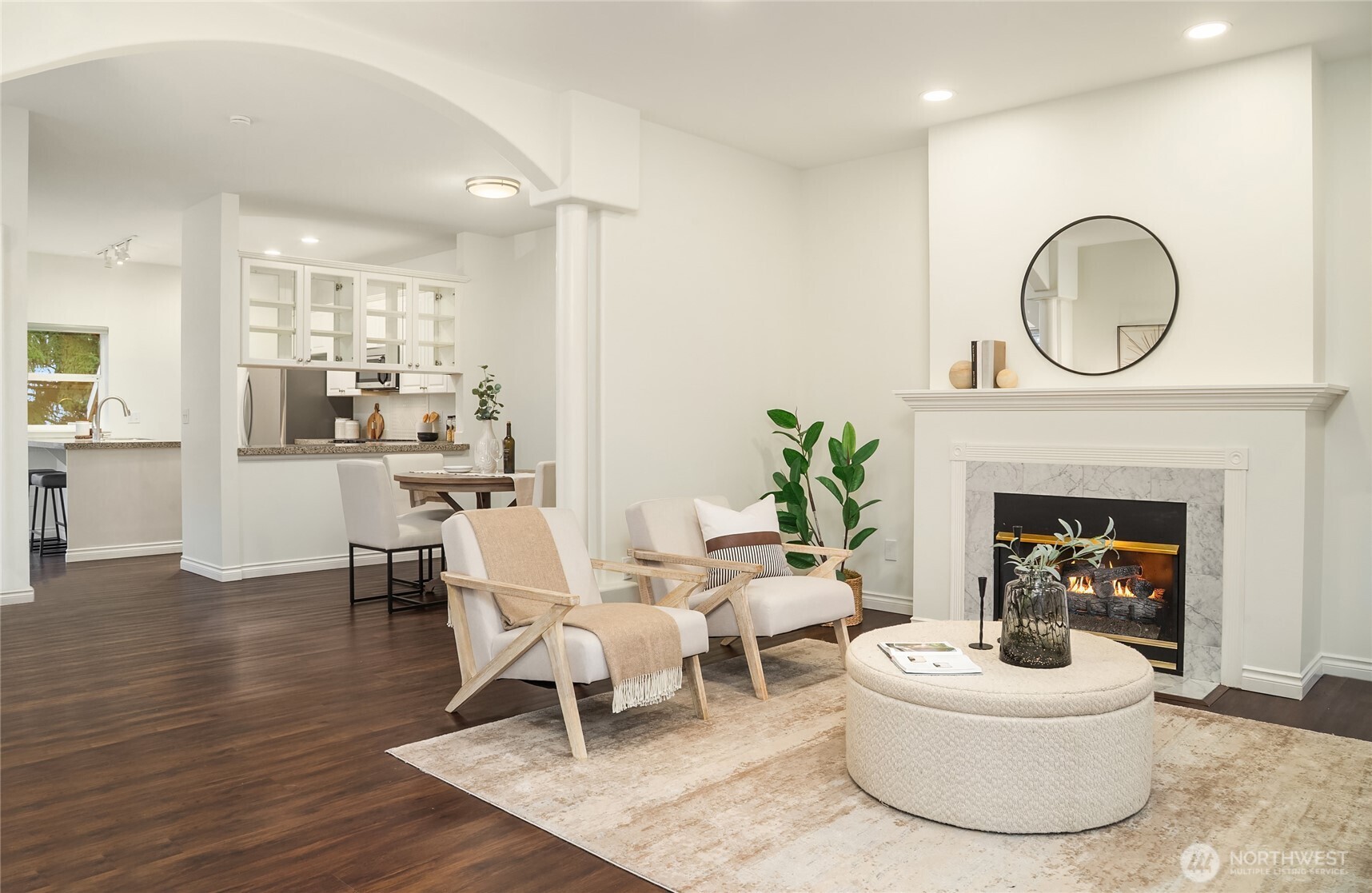 755 Northwest Juniper Street Issaquah, WA 98027 - Photo 8 of 39 a living room with furniture a fireplace a rug and a fireplace