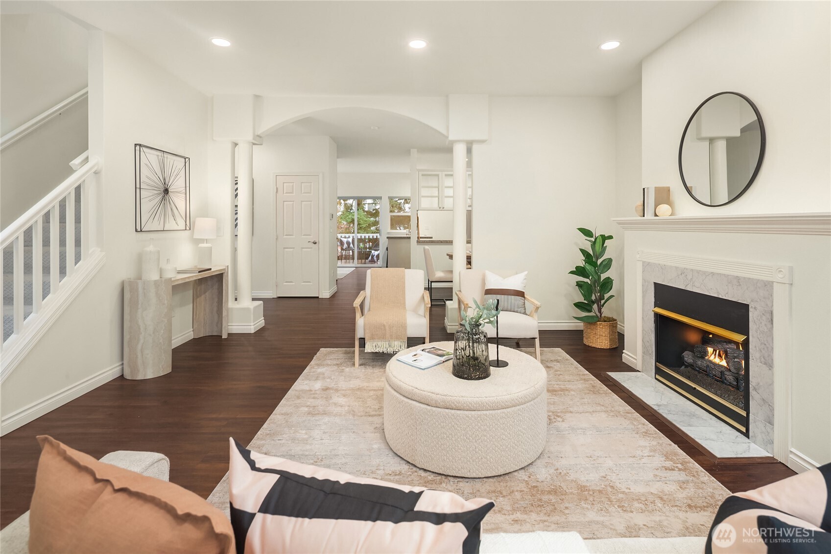 755 Northwest Juniper Street Issaquah, WA 98027 - Photo 10 of 39 a living room with furniture a fireplace and a large window