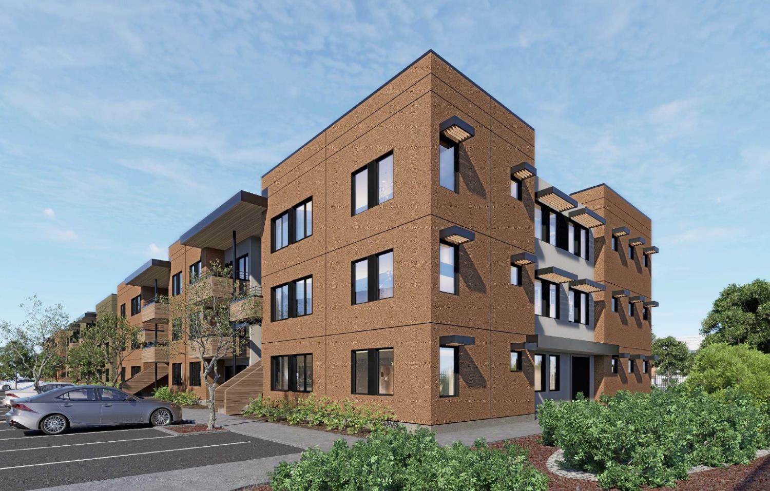 8740 Bruceville Road Sacramento, CA 95823 - Photo 6 of 11 a front view of a building with lot of cars and trees