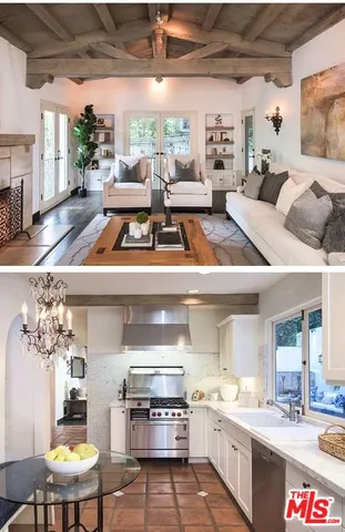 a open kitchen with stainless steel appliances granite countertop a stove a sink and a refrigerator