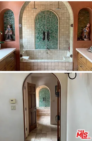 a living room with a sink and a mirror