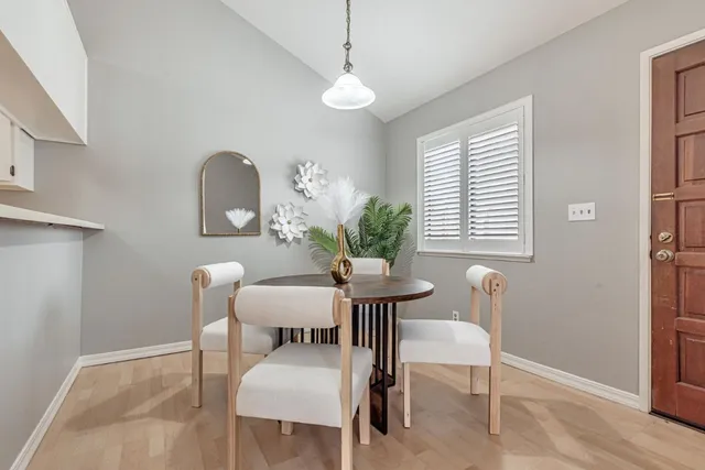 a dining room with furniture and window