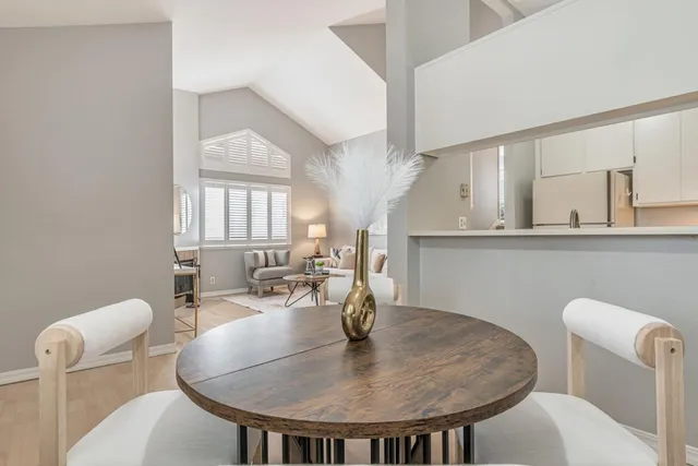 a dining room with furniture and window