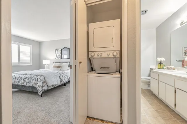 a bedroom with a bed and a mirror