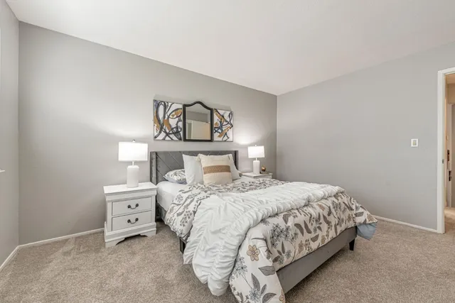 a bedroom with a bed and window