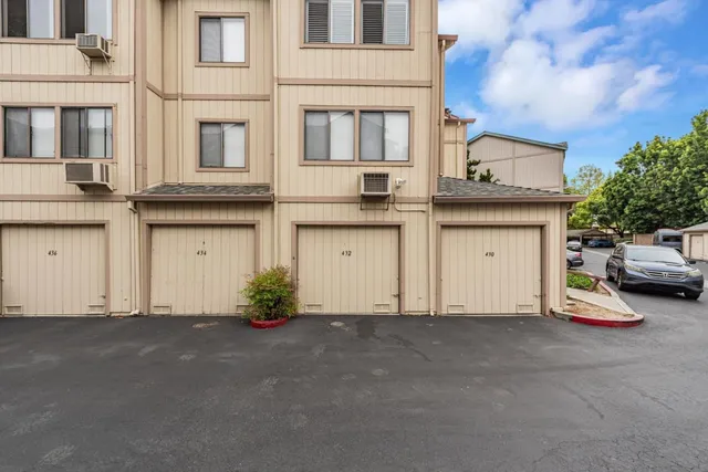 a view of a car park front of house