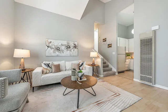 a living room with furniture and a table