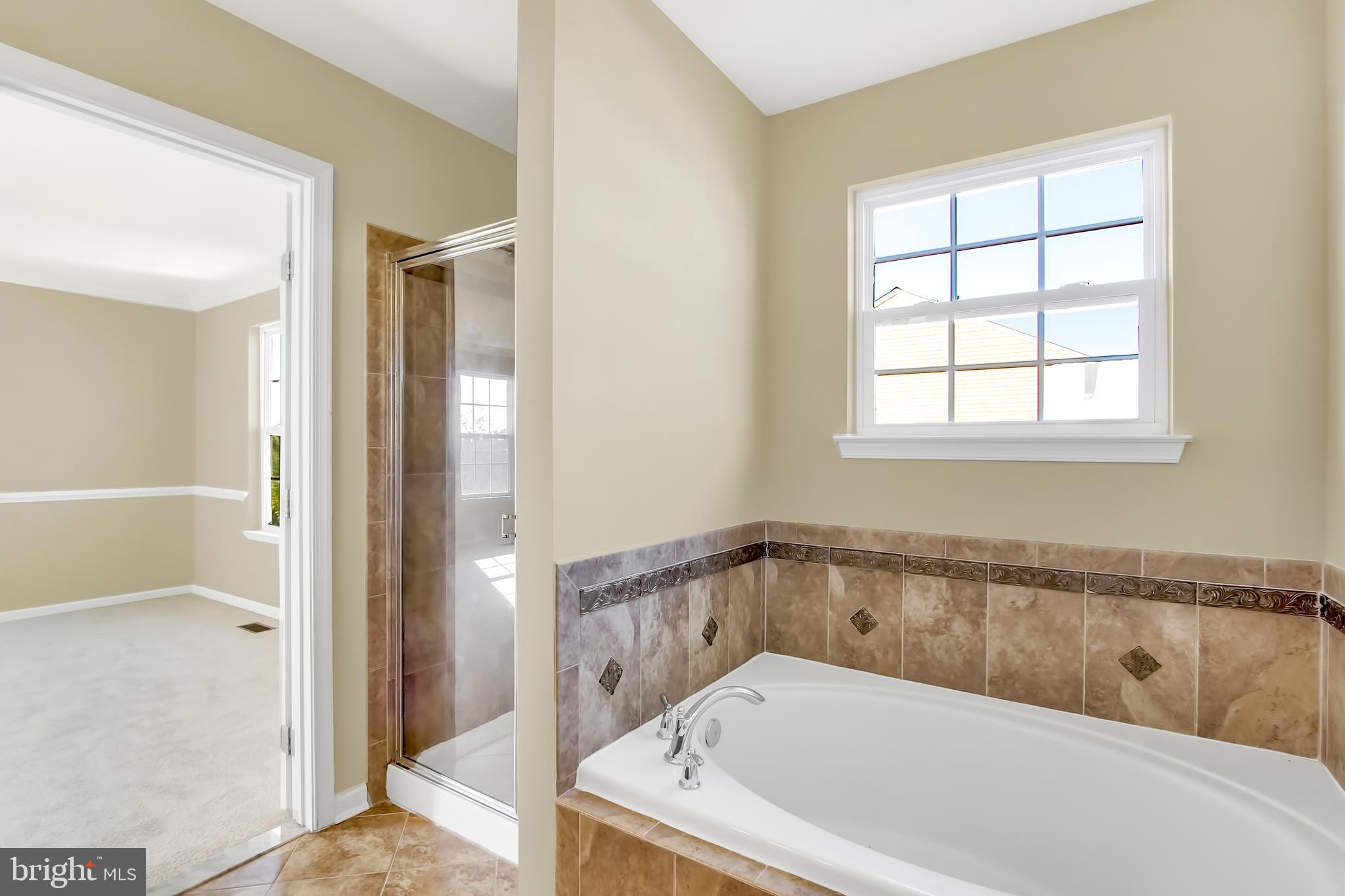 4721 Ridge Road Baltimore, MD 21236 - Photo 14 of 29 Beautiful tile work highlights Master Bath