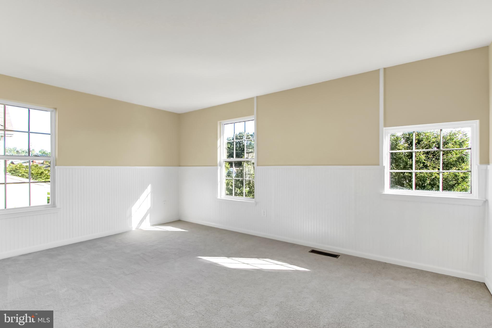 4721 Ridge Road Baltimore, MD 21236 - Photo 16 of 29 Add'l Bedroom - wainscoting accents the walls