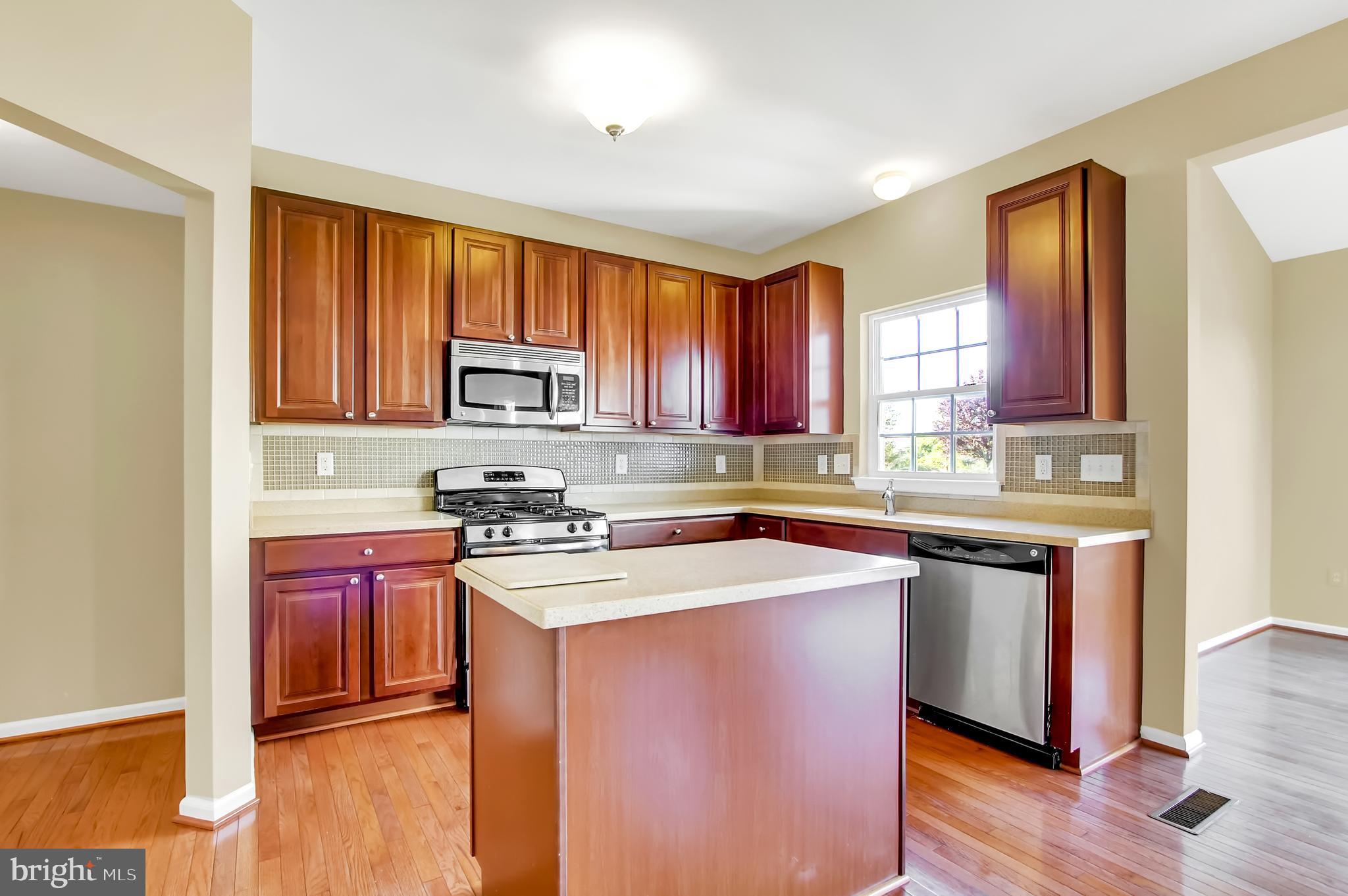 4721 Ridge Road Baltimore, MD 21236 - Photo 8 of 29 Hardwood Floors & Corian counters
