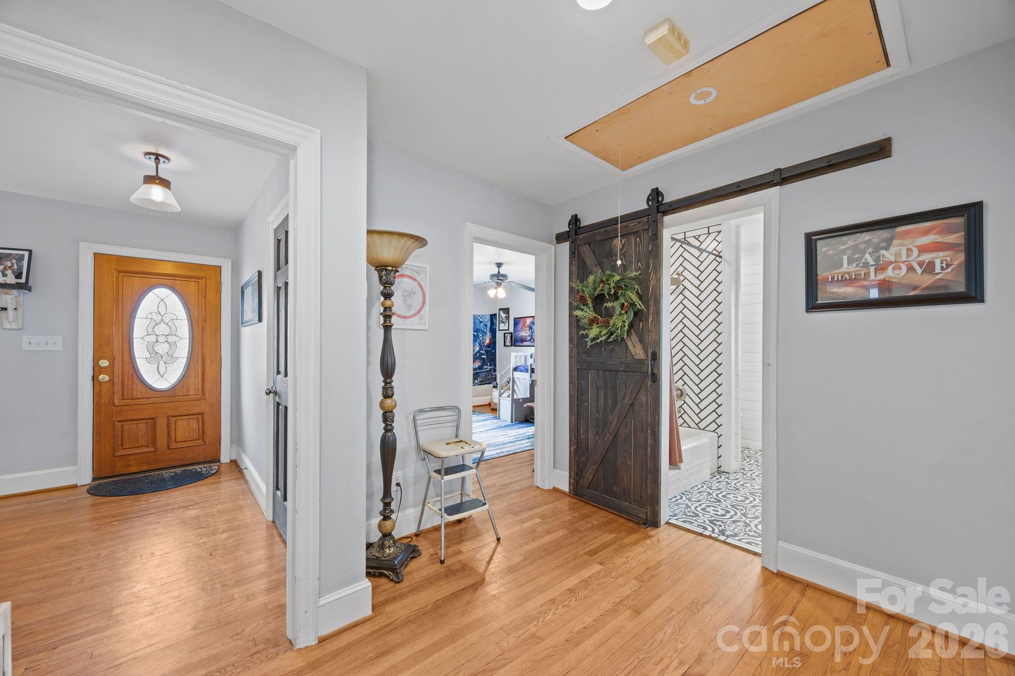 275 Tanner Street Rutherfordton, NC 28139 - Photo 34 of 44 a view of a hallway with wooden floor and entryway