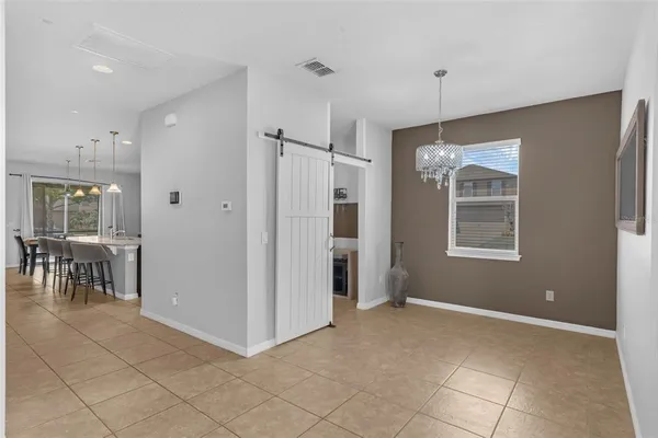 a view of kitchen with furniture and window