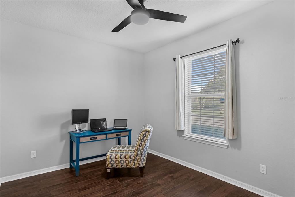 1641 Regal River Circle Ocoee, FL 34761 - Photo 13 of 42 a room with furniture and a window