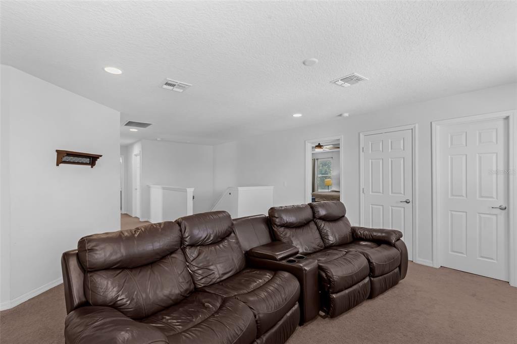 1641 Regal River Circle Ocoee, FL 34761 - Photo 21 of 42 a living room with furniture and a couch
