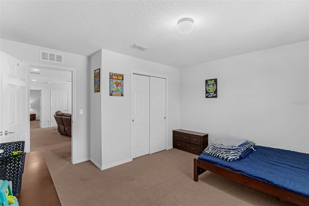 1641 Regal River Circle Ocoee, FL 34761 - Photo 34 of 42 a living room with furniture and a couch