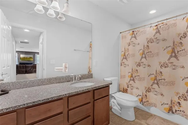 a view of wooden floor and windows in a room