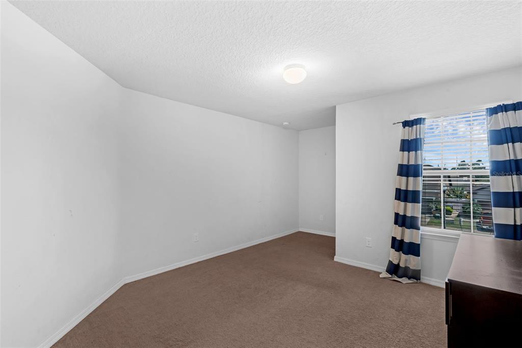 1641 Regal River Circle Ocoee, FL 34761 - Photo 36 of 42 a view of wooden floor and windows in a room