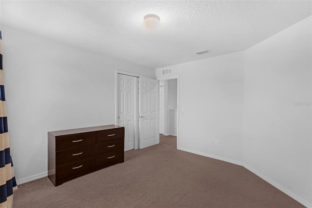 1641 Regal River Circle Ocoee, FL 34761 - Photo 37 of 42 a room with a dresser in it