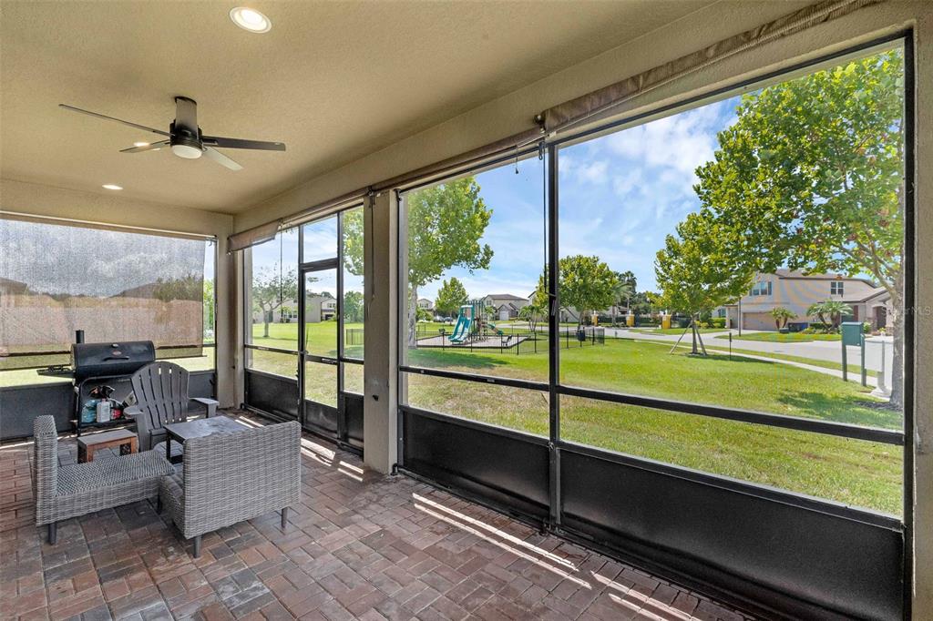 1641 Regal River Circle Ocoee, FL 34761 - Photo 40 of 42 a living room with couch and a floor to ceiling window
