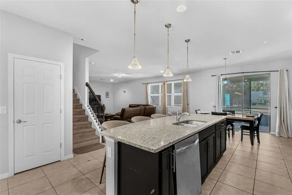 a open kitchen with a table and chairs