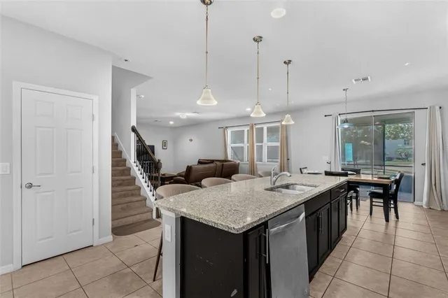 a open kitchen with a table and chairs