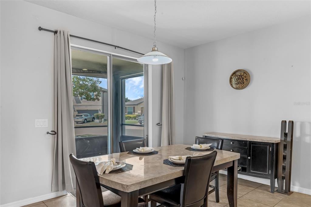 1641 Regal River Circle Ocoee, FL 34761 - Photo 7 of 42 a view of a dining room with furniture window and outside view