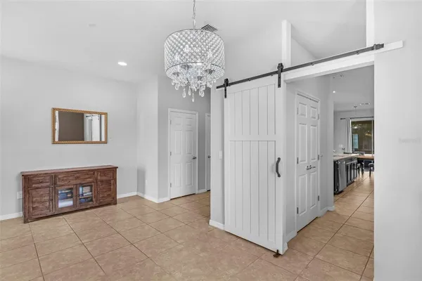 a very nice looking hallway with a chandelier